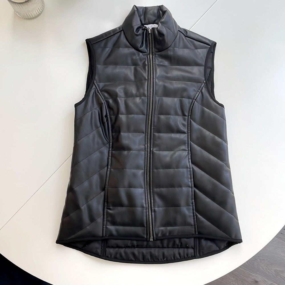 Barney’s black quilted vest